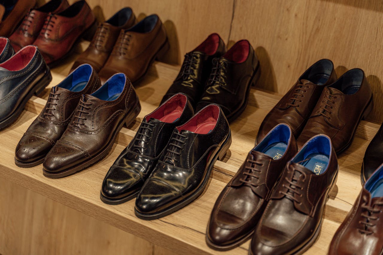 digital Showcase of elegant leather dress shoes on wooden shelves in-store display.